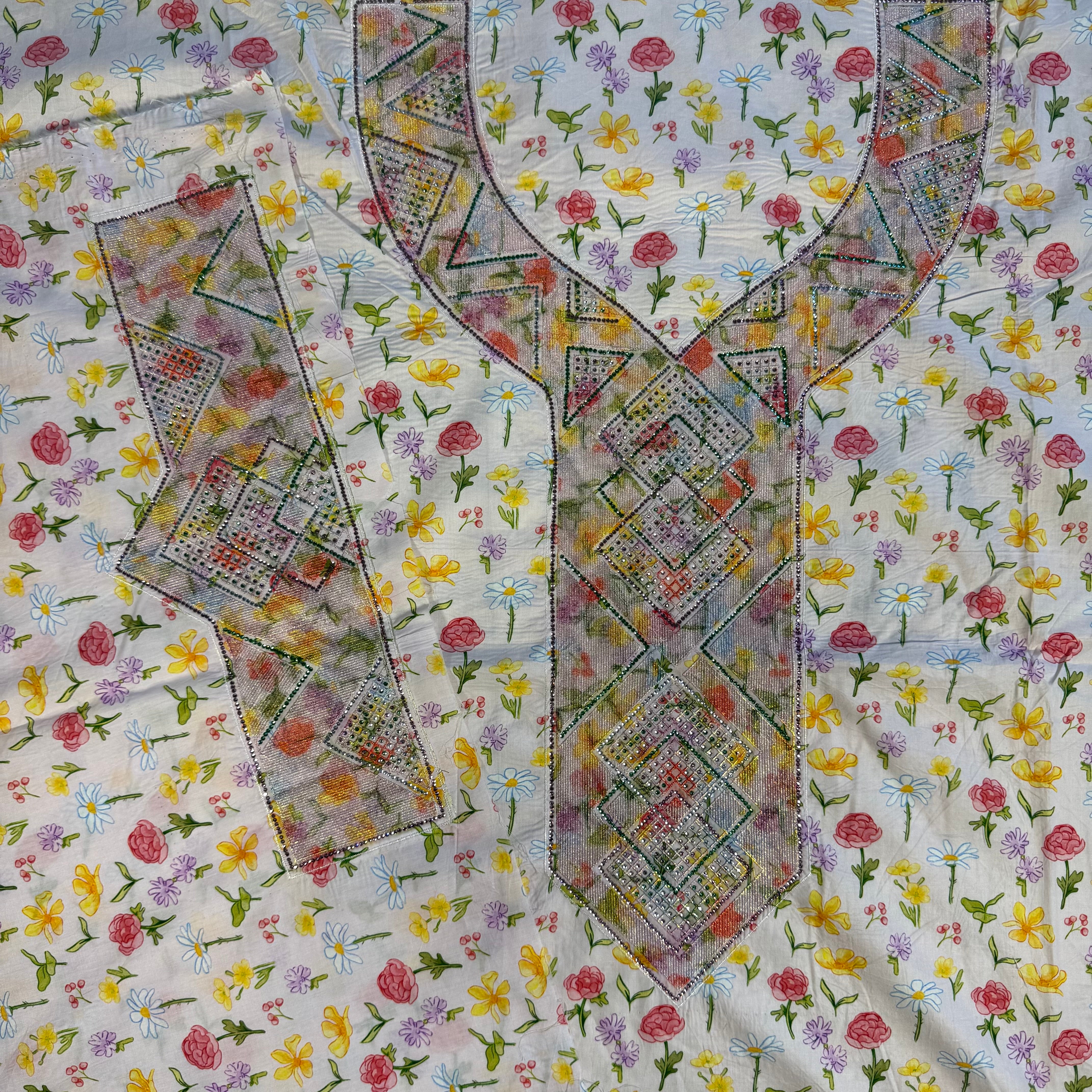 Laser-cut abaya with stone embellishments and print.