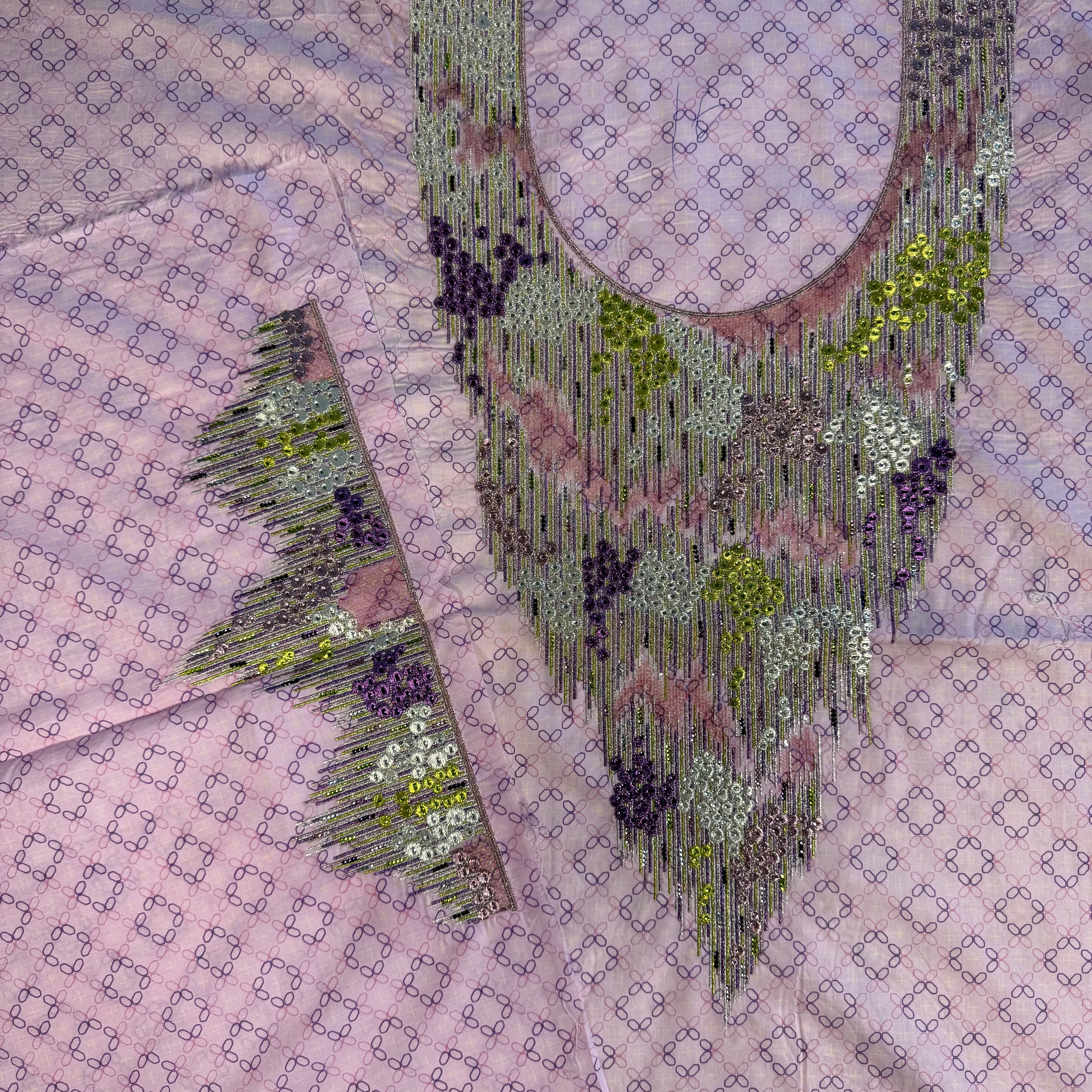 Laser-cut thobe with beaded print